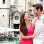 happy-tourists-couple-having-fun-during-travel-in-Plaza-de-la-Catedral-Old-Havan-cuba-1600×1066
