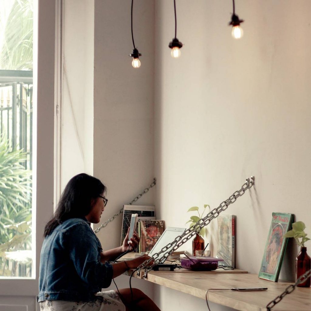 coffee shop women girl sit work jogja skripsi book buku dasmu garage lamp alone